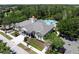 Aerial view of the community clubhouse and pool, surrounded by manicured landscaping at 6152 Meriwether, Winter Garden, FL 34787