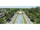 Aerial view of the community center featuring lush landscaping, a water feature and a manicured lawn at 6152 Meriwether, Winter Garden, FL 34787