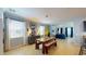 Bright dining area with a wooden table, bench seating, and an open view to the living area at 6152 Meriwether, Winter Garden, FL 34787