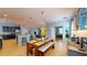 Open concept dining area with view of kitchen, pendant lighting and seating for six at 6152 Meriwether, Winter Garden, FL 34787