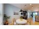 Dining nook features a white table and seating next to the kitchenette with stainless fridge at 6152 Meriwether, Winter Garden, FL 34787