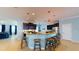 Modern kitchen with dark cabinets, stainless steel appliances, and barstool seating at the countertop at 6152 Meriwether, Winter Garden, FL 34787