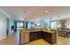 Open kitchen with granite counters, stainless dishwasher and backyard views at 6152 Meriwether, Winter Garden, FL 34787