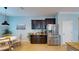 A kitchenette featuring stainless refrigerator, dark wood cabinets, and a breakfast nook at 6152 Meriwether, Winter Garden, FL 34787