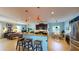 Spacious open-concept kitchen with a large island and modern stainless steel appliances at 6152 Meriwether, Winter Garden, FL 34787