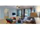 Comfortable living room with a ceiling fan and sliding doors that lead to an outdoor area at 6152 Meriwether, Winter Garden, FL 34787