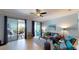 Living room with sliding glass doors leading to the patio, providing ample natural light at 6152 Meriwether, Winter Garden, FL 34787