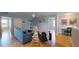 Bright loft area with modern furniture, hardwood floors, and soft blue wall paint at 6152 Meriwether, Winter Garden, FL 34787