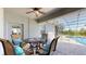Cozy patio set with views of the screened-in pool is ideal for outdoor dining at 6152 Meriwether, Winter Garden, FL 34787