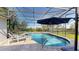 Enclosed pool area with screen and lake view at 6152 Meriwether, Winter Garden, FL 34787
