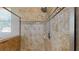 Tiled shower with a rainfall showerhead and decorative tile border at 6152 Meriwether, Winter Garden, FL 34787