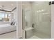 Modern walk-in shower with bench in the en-suite bathroom at 6324 Dew Drop Loop, St Cloud, FL 34771