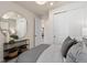 Bedroom with a large mirror and double sliding-door closet at 6324 Dew Drop Loop, St Cloud, FL 34771