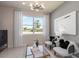 Inviting sitting area with a large window, plush chairs, decorative pillows and neutral decor at 6324 Dew Drop Loop, St Cloud, FL 34771