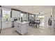 Open concept kitchen and living area filled with natural light and modern finishes at 6324 Dew Drop Loop, St Cloud, FL 34771