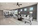 Bright, open-concept living space with a modern kitchen, dining, and seating area at 6324 Dew Drop Loop, St Cloud, FL 34771