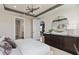 Bright main bedroom featuring modern lighting, walk-in closet, and en-suite bathroom at 6324 Dew Drop Loop, St Cloud, FL 34771