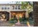Home backyard featuring a screened lanai with a paver path lined with plantings at 6874 Sperone St, Orlando, FL 32819
