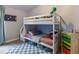 Charming ' bedroom with bunkbed, colorful accents, and plenty of storage space for toys at 6874 Sperone St, Orlando, FL 32819