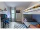 Charming ' bedroom with bunkbed, desk, and cozy space featuring a checkered rug at 6874 Sperone St, Orlando, FL 32819