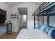 Bedroom view features a bunkbed, sleek desk, and minimalist decor creating an inviting atmosphere at 6874 Sperone St, Orlando, FL 32819