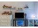' bedroom features custom shelving, a modern desk, and a bright blue chair at 6874 Sperone St, Orlando, FL 32819