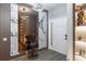 Elegant entryway featuring a stylish mirror and a modern light fixture at 6874 Sperone St, Orlando, FL 32819