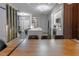 Open-concept kitchen and dining area with modern white cabinets, a large island and stylish pendant lights at 6874 Sperone St, Orlando, FL 32819