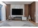 Living room boasts custom wall with fireplace and unique design at 6874 Sperone St, Orlando, FL 32819