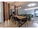Open concept living spaces with cohesive design between the indoor and outdoor living spaces at 6874 Sperone St, Orlando, FL 32819
