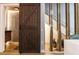 A stylish barn door next to a decorative staircase at 6874 Sperone St, Orlando, FL 32819