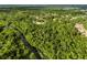 Extensive wooded area with a waterway running through it, showcasing a natural and private setting at 8368 Rambling River Dr, Sanford, FL 32771