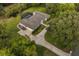 Stunning aerial view of a large property showcasing the house, a long driveway, and a screened-in pool at 8368 Rambling River Dr, Sanford, FL 32771