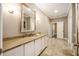 Spacious bathroom featuring a stone countertop vanity, tiled floor, and tub shower at 8368 Rambling River Dr, Sanford, FL 32771