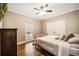 Cozy bedroom with a comfortable bed, wood floors, and a window at 8368 Rambling River Dr, Sanford, FL 32771