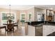 Cozy breakfast nook featuring large windows and a view of the backyard and pool at 8368 Rambling River Dr, Sanford, FL 32771