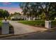Inviting single-story home features a circular driveway, mature trees, and manicured landscaping at 8368 Rambling River Dr, Sanford, FL 32771