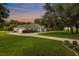Beautiful home with a long driveway, lush landscaping, and sprawling lawn offers a welcoming curb appeal at 8368 Rambling River Dr, Sanford, FL 32771