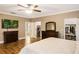 Spacious main bedroom with dark wood floors, walk-in closet, and private bathroom access at 8368 Rambling River Dr, Sanford, FL 32771
