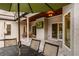 Beautiful outdoor patio with television, dining table and seating, and shade at 8368 Rambling River Dr, Sanford, FL 32771