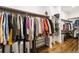 Well-organized walk-in closet with ample hanging space, shelving, and organizers at 8368 Rambling River Dr, Sanford, FL 32771