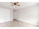 Empty bedroom featuring wood-look floors and a closet at 855 Third St, Orange City, FL 32763