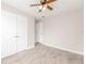 Bedroom featuring light gray walls, wood-look flooring and double closet doors at 855 Third St, Orange City, FL 32763