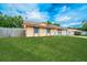 Well-kept home with a spacious front yard and mature trees at 855 Third St, Orange City, FL 32763