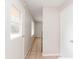 Hallway with tiled floor leading to kitchen area and the backyard at 855 Third St, Orange City, FL 32763
