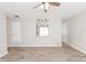 Bright living room with wood-look flooring and a ceiling fan at 855 Third St, Orange City, FL 32763