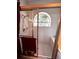 Bathroom stall with white tiles, a shower, and a glass door at 8935 Jonathan Manor Dr, Orlando, FL 32819