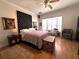 Cozy bedroom with a large headboard, bay windows, and stylish decor at 8935 Jonathan Manor Dr, Orlando, FL 32819