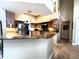Modern kitchen with stainless steel appliances, granite countertops, wooden cabinetry, and tile flooring at 8935 Jonathan Manor Dr, Orlando, FL 32819