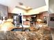 Updated kitchen with granite countertops, stainless steel appliances, custom cabinetry, and a gas range for cooking at 8935 Jonathan Manor Dr, Orlando, FL 32819